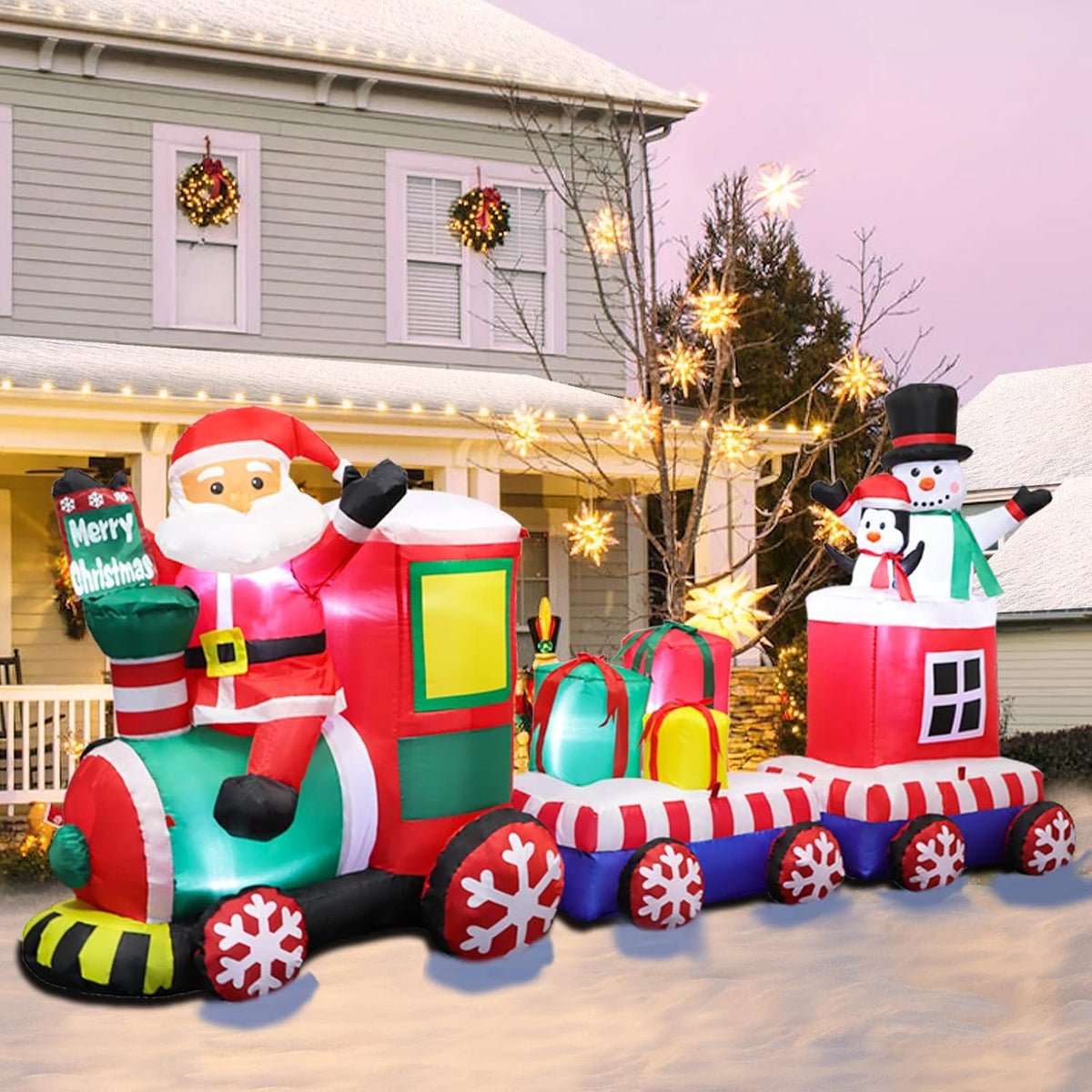 Christmas train inflatable with Santa driving, gift boxes and a snowman in the back car