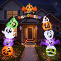 Cute Happy Halloween arch inflatable with stacked pumpkins, ghosts, a bat and a mummy over a front path